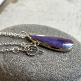 Charoite and gold pendant