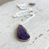 Charoite and gold pendant