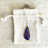 Charoite and gold pendant