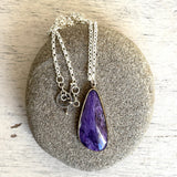 Charoite and gold pendant